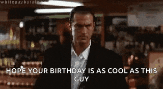 a man in a suit is standing in front of a bar .