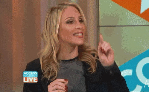 a woman appears on access hollywood live on a screen