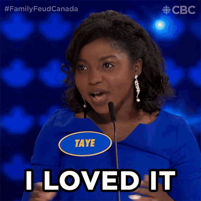 a woman in a blue shirt with a name tag that says taye says i loved it