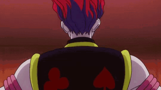 a cartoon character with red hair and a black vest with playing cards on it .