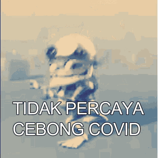a blurry picture of a baby with the words tidak percaya cebong covid