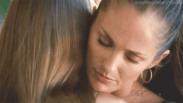 a close up of two women hugging with a caption that says channel 4