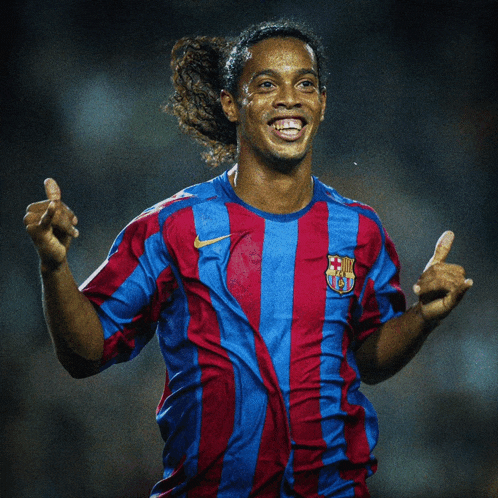 a soccer player wearing a striped shirt with the fcb logo on it
