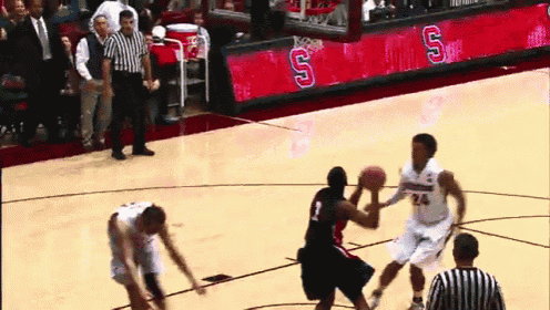 a basketball game is being played on a court with the letter s on the side