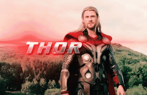 a man in a thor costume stands in front of a mountain