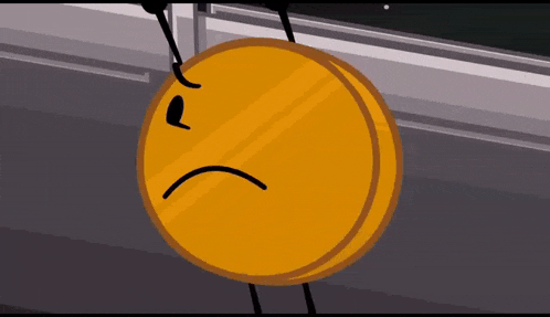 a cartoon coin with a sad face is sitting on a table .