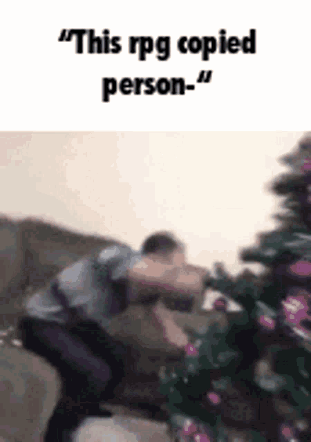 a man is putting purple ornaments on a christmas tree and says `` this rpg copied person . ''