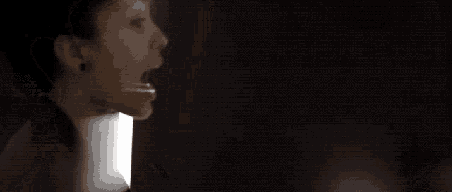 a blurry picture of a woman 's face with a white border