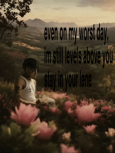 a man sits in a field of pink flowers with the words even on my worst day