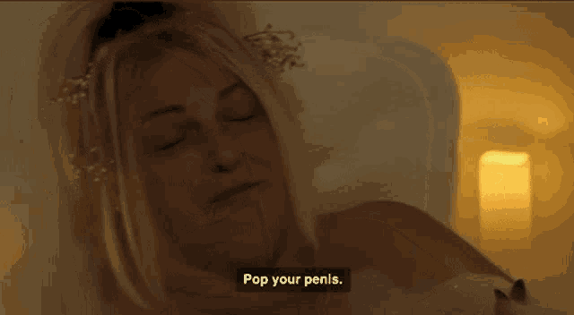 a woman is laying in a bathtub with her eyes closed and says pop your penis