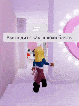 a girl with pink hair is walking down a hallway with a message in a foreign language behind her