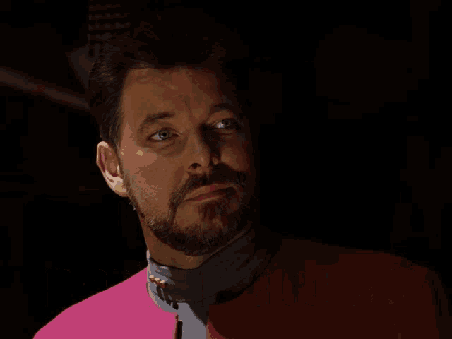 a man in a pink jacket with the words speak for yourself