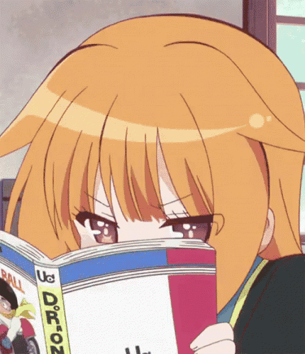 a girl is reading a book that says dragon on the cover