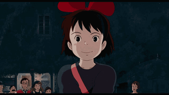 a girl with a red bow on her head stands in front of a group of people