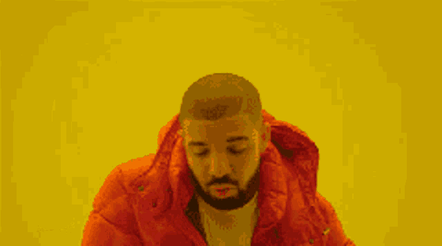 a man with a beard is wearing a red jacket against a yellow background .