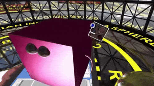 a pink cube is surrounded by a sphere sign