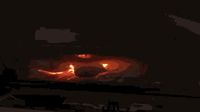 a fire burns in a fireplace with a brick wall