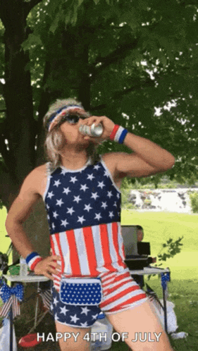 a man in an american flag outfit drinking a beer