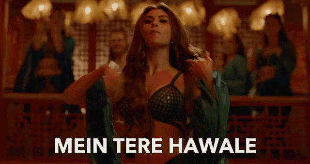 a woman is dancing with the words mein tere hawale written below her