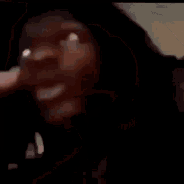 a close up of a person taking a picture with a camera .