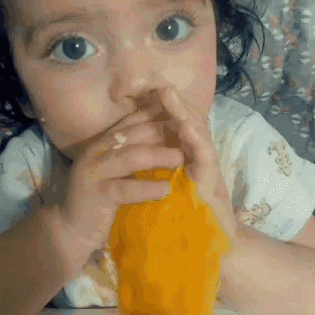 Kid Eating GIF - Kid Eating Mango GIFs