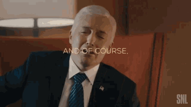 a man in a suit and tie is sitting in a chair with the words " and of course " behind him
