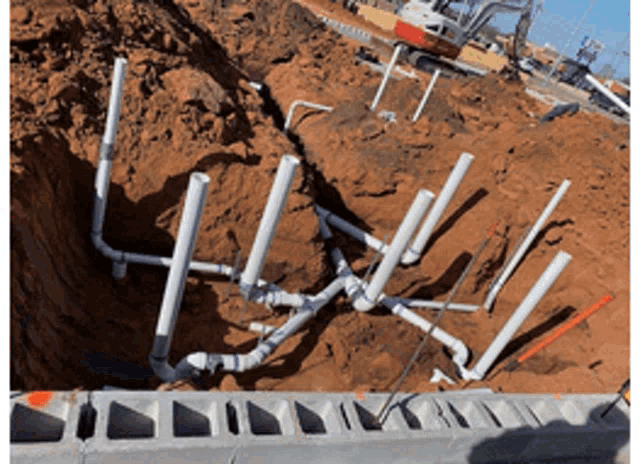 a bunch of pipes are laying in the ground