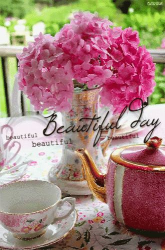 a tea set with a vase of pink flowers and the words beautiful day on the bottom
