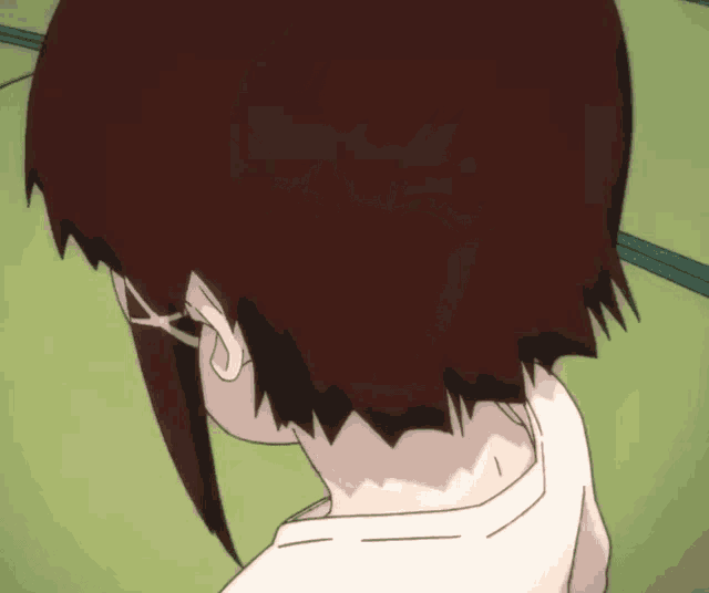 a close up of a person 's head with a white shirt on