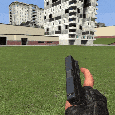 a person is holding a gun in front of a building