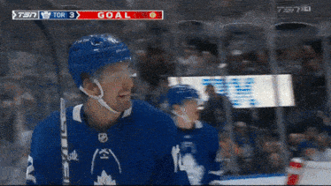 a hockey game is being played and the score is 3 to 0