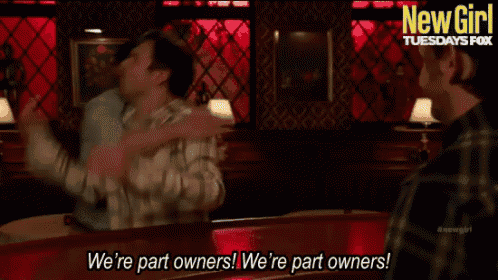 two men hugging in a bar with the words we 're part owners on the bottom