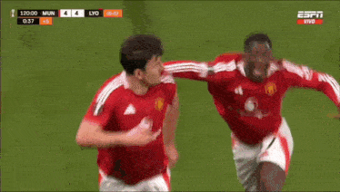 a soccer player wearing a red shirt that says snapdragon on it