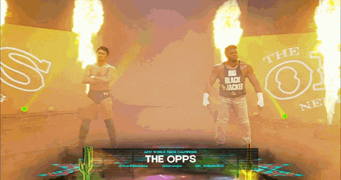 two wrestlers are standing in front of a banner that says the opps on it