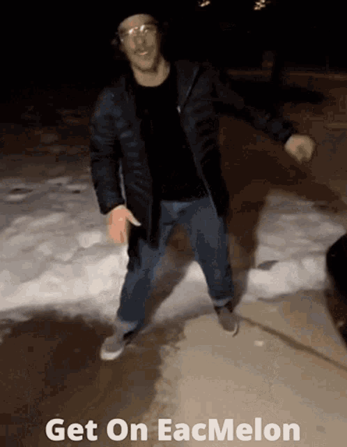 a man is dancing in the snow with the words get on eacmolon written below him