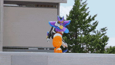 a person in a purple and blue costume is riding a robot