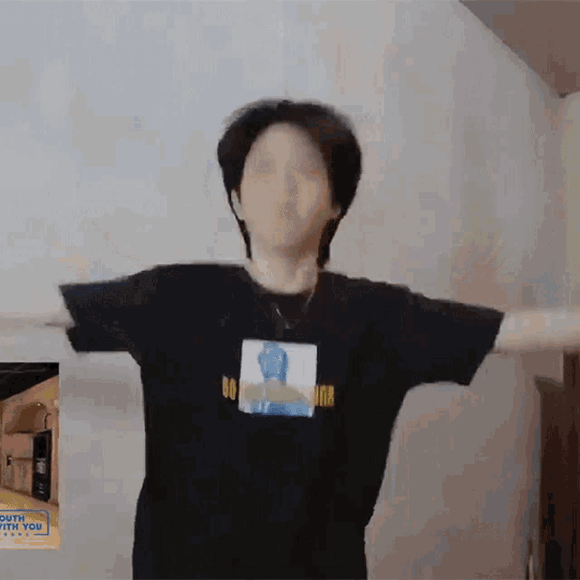 a person wearing a black shirt that says ' go high ' on it