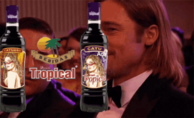 a bottle of tropical bebidas next to a man