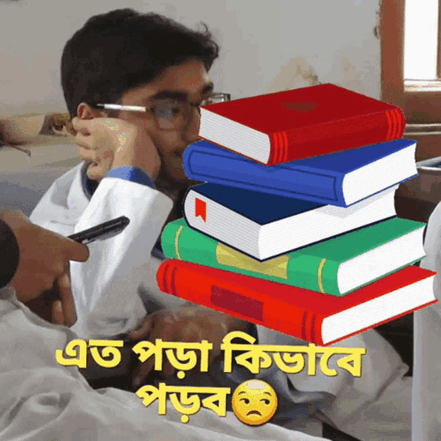 a man in a lab coat is sitting in front of a stack of books with a sad face on the bottom