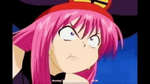 a girl with pink hair and a red hat is making a funny face