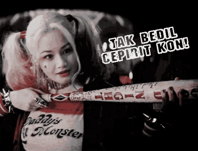 a woman dressed as harley quinn holding a bat