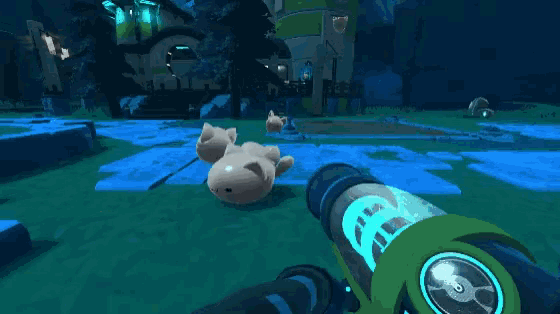 a person is holding a gun in front of a large ball in a game .
