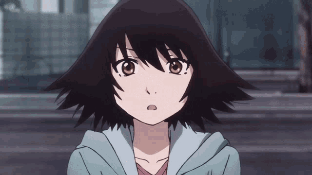 a girl with a surprised look on her face is wearing a blue hoodie