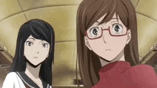 two anime girls wearing glasses are standing next to each other in a room .