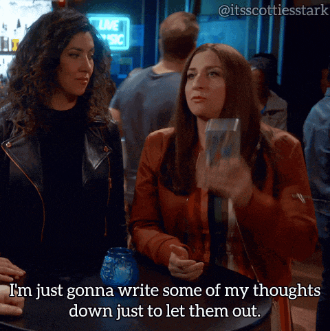 two women sitting at a table looking at their phones with the caption i 'm just gonna write some of my thoughts