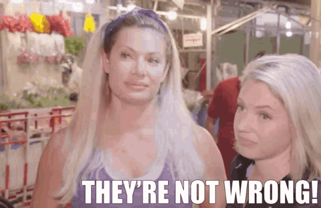 two women standing next to each other with the words " they 're not wrong " written below them