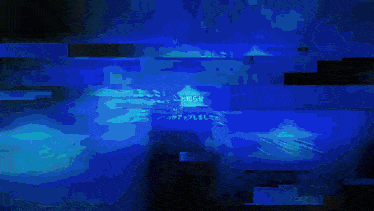 a blurred image of a person 's face with a blue background