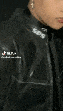 a close up of a man 's face with a tiktok sticker