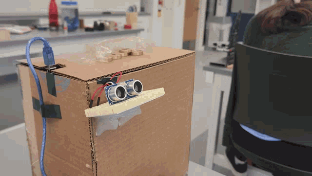 a cardboard box with a sticker on it that says ' ultrasonic sensor ' on it