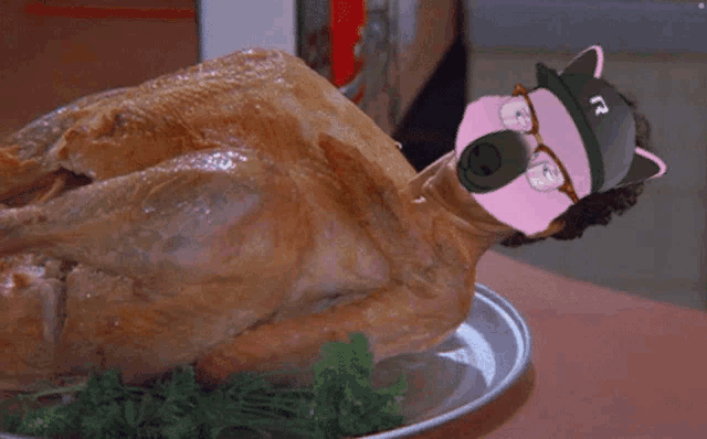 a turkey on a plate with the letter r on it 's head